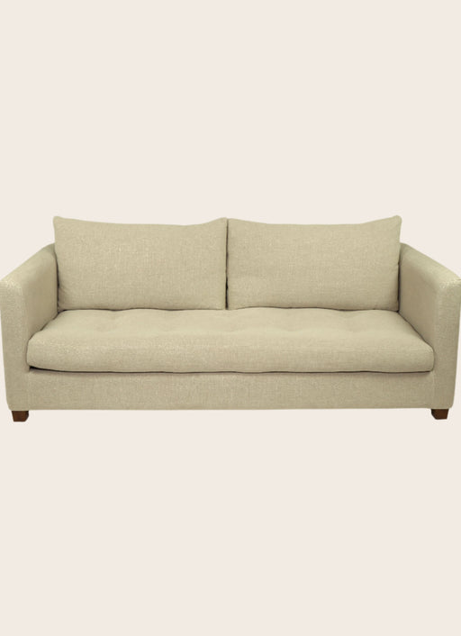 Canapé capitonné en tissu blanc