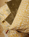 Housse de coussin Tulipan curcuma avec ses délicats pompons signature