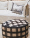 Petit pouf rond au design organique