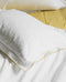 Petite housse de coussin Bora blanche à liseré coloré