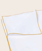 Literie : housse de couette en coton bio blanc avec une surpiqure jaune