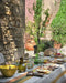 Table d'été dressée avec le linge de table Soleo