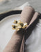 Rond de serviette Floria avec 3 fleurs en métal doré