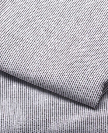 Linge de lit : drap en lin lavé avec des petites rayures bleues