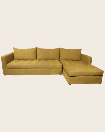 Grand canapé d'angle capitonné