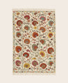 Tapis Lohdi en laine avec ses franges délicates et ses motifs fleuris colorés