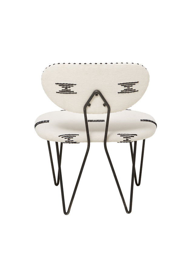 Dos du fauteuil trombone de chez Caravane