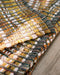 Détail du tissage du tapis Lira lirette de coton recyclé Curcuma