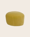 Petit pouf rond en tissu pour un salon Caillou